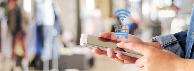 online shopper using smartphone for purchase, floating shopping cart