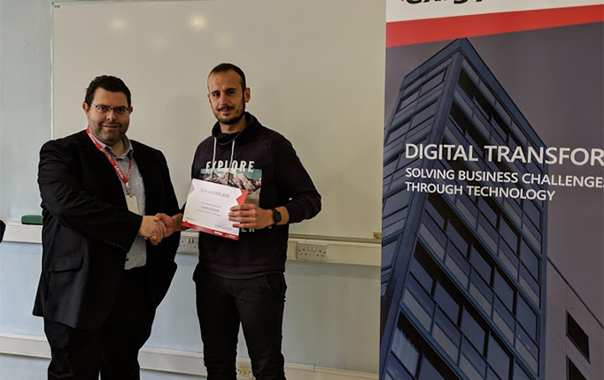 male student taking photo with ceo in classroom, shaking hands