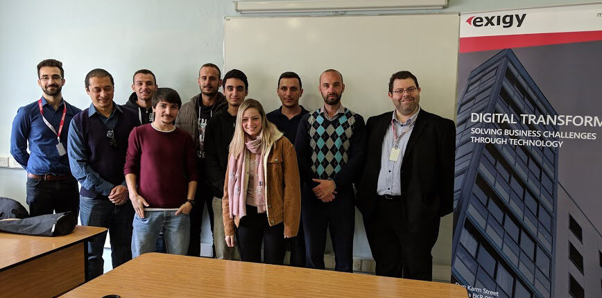 group of students taking photo with ceo in a classroom