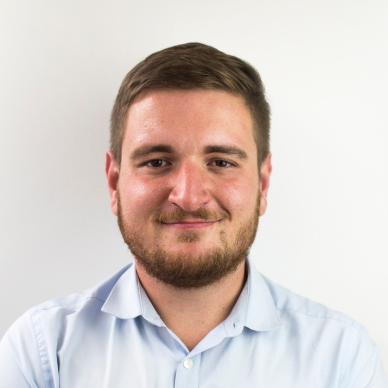 smiling employee wearing blue shirt