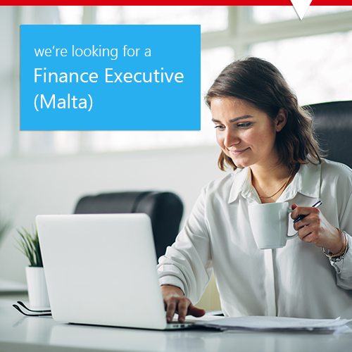 Smiling finance executive working on laptop